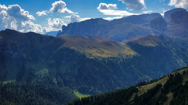 Panoramic view of the beautiful Val di Fassa in Trentino Alto Adige, Italy. Mountains, valleys and plateaus of northern Italy. Fresh air and exciting landscapes of the Dolomites. Pale di San Martino.