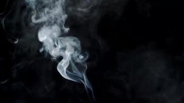 Smoke On Black Background. Smoke created by a small fire.