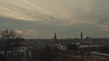 Timelapse of a sunset on Verona, Italy. Inspirational yellow sunset on Verona, Italy. Time lapse. Cloudy evening.
