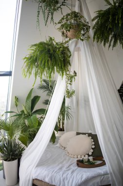 Ev samimi iç mekan. Boho Style Yatak Odası İçi. Style Boho 'da güzel bir iç mekan. Yumuşak Yastıklarla Yatmak