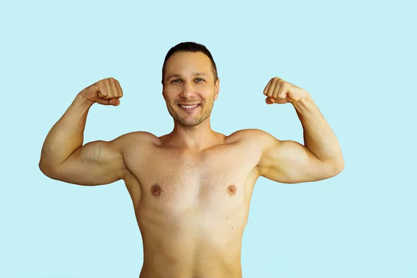 Portrait Funny Man Showing His Muscles Blue Background — Stockfoto