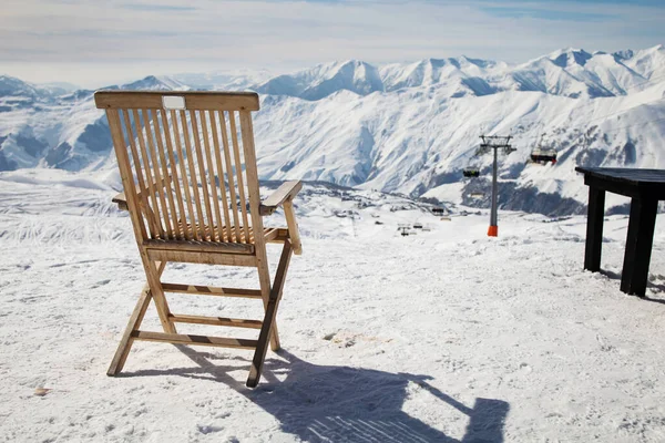 Chair at mountains in winter, Val-d\'Isere, Alps, skis, sticks in snowy resort.