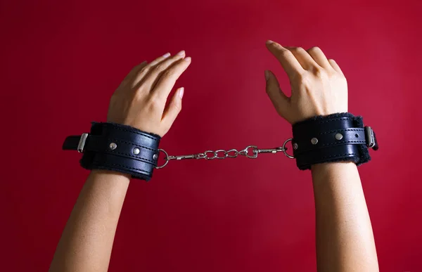 Cropped Shot Woman Erotic Play Black Leather Handcuffs Red Background — Stock Photo, Image