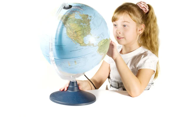 Beautiful little girl with a globe. — Stock Photo, Image
