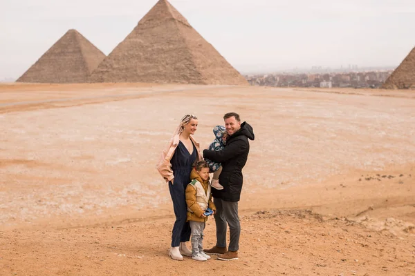 happy tourist family in Giza. holiday travel tpur near Pyramid o