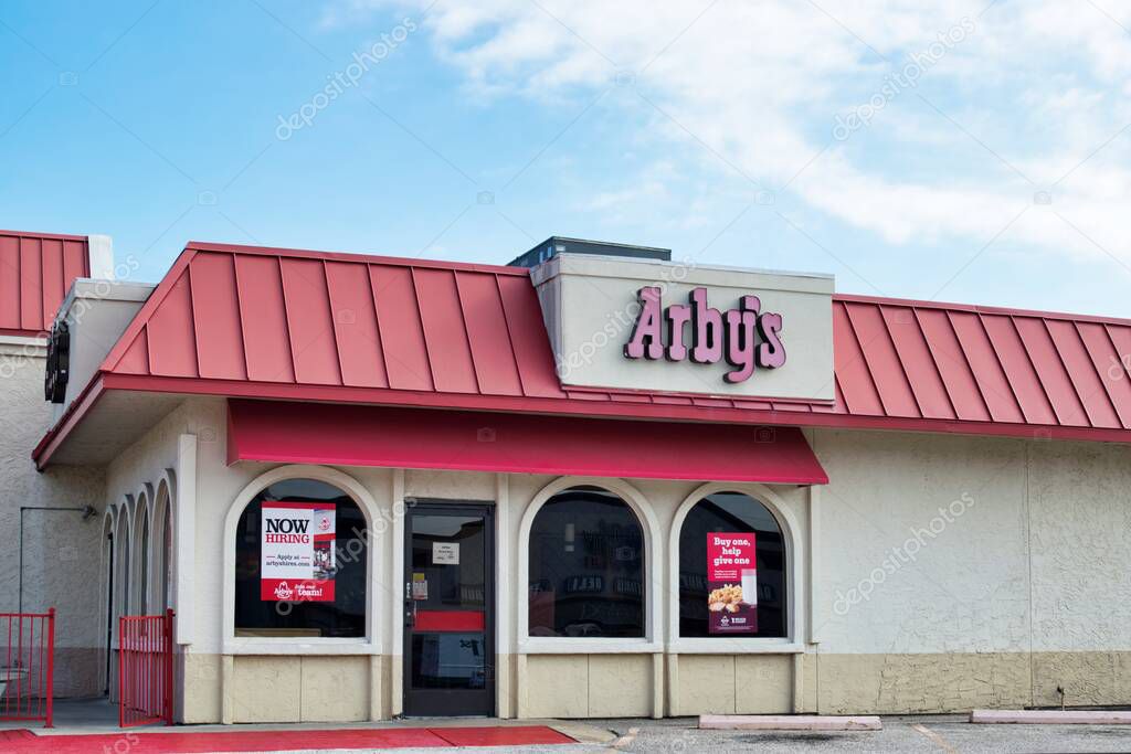 Houston, Texas USA 11-12-2021: Arby's fast food storefront in Houston TX. American sandwich restaurant chain founded in 1964.