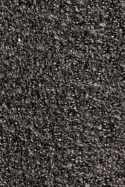 Tar black expanded polyethylene foam sample background EPE beads packing material textures.