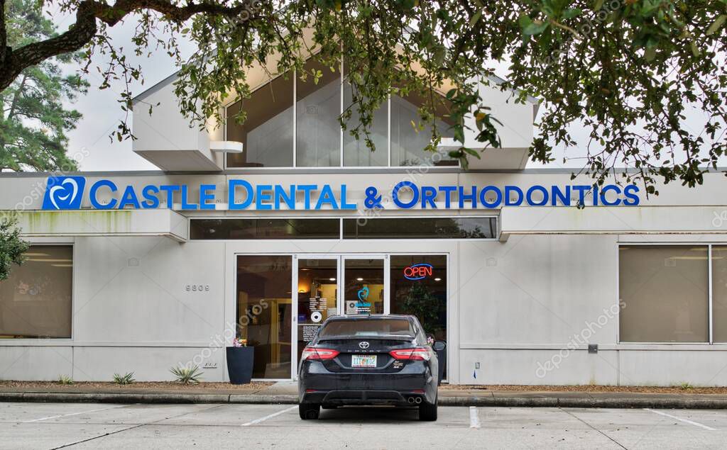 Houston, Texas USA 12-03-2021: Castle Dental and Orthodontics office building exterior in Houston, TX. Health and wellness local business.