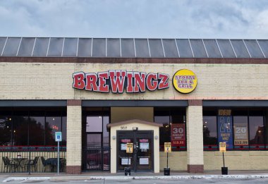 Houston, Texas USA 12-03-2021: BreWingZ Sports Bar and Grill storefront exterior in Houston, TX. Local fast food restaurant chain.