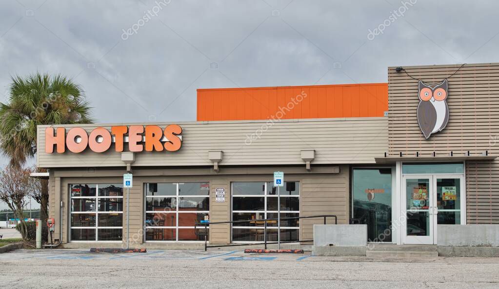 Houston, Texas USA 12-03-2021: Hooters restaurant and bar exterior in Houston, TX. Food service business chain founded in 1983.