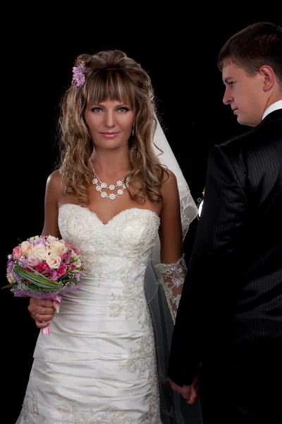 Happy newlyweds in studio — Stock Photo, Image