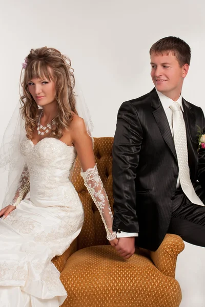 Happy newlyweds in studio — Stock Photo, Image