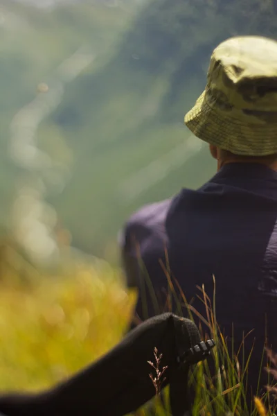 Man in panama enjoying a landscape — Stock Photo, Image