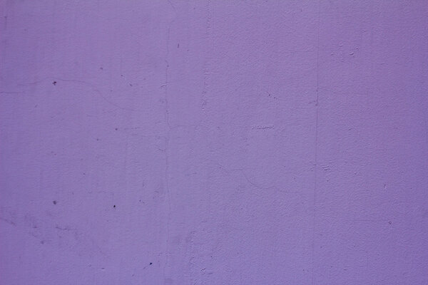 textured purple wall with crack