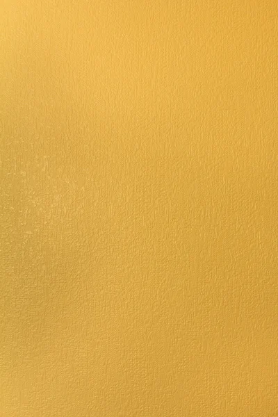 Желтая гранж стена, текстурированный фон — стоковое фото