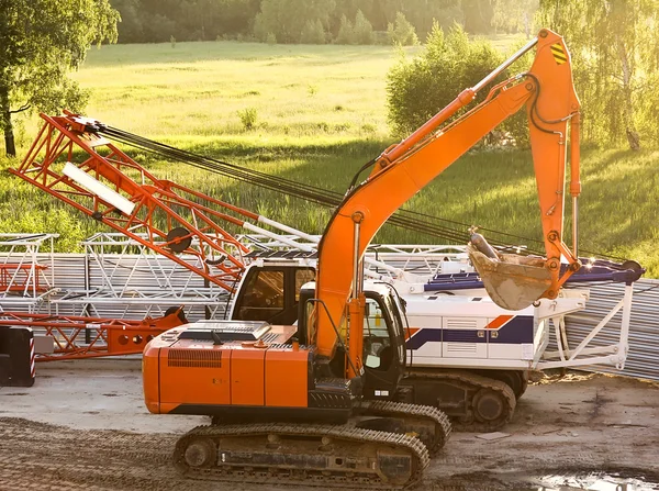 Modern orange excavator machines — Stock Photo, Image