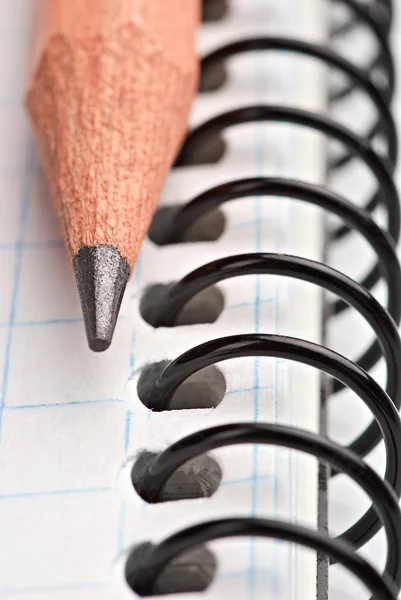 Close up a wooden pencil on the book — Stock Photo, Image