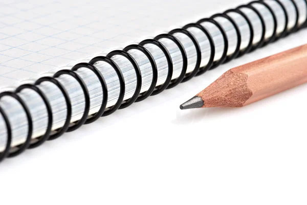Close-up of notebook and pencil — Stock Photo, Image
