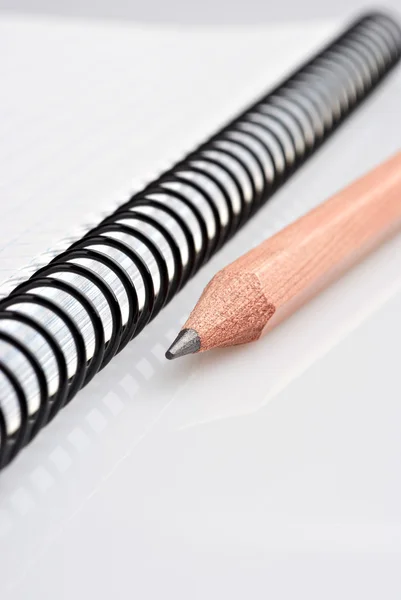 Close-up of notebook and pencil — Stock Photo, Image