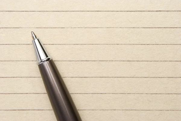 Penna på ett papper — Stockfoto