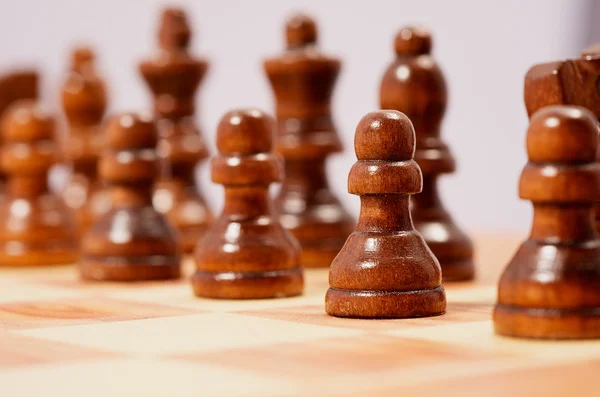 Chessmen on a chessboard — Stock Photo, Image