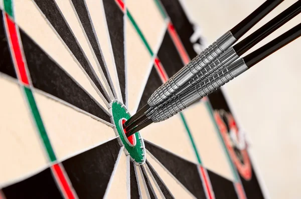 Dart in bullseye on the target — Stock Photo, Image