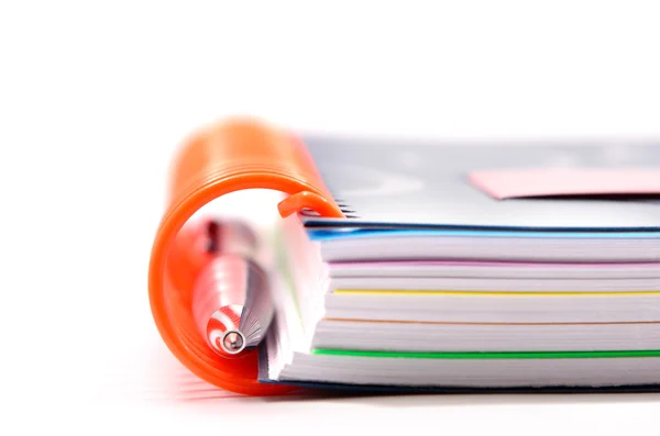 Notebooks with orange spring — Stock Photo, Image