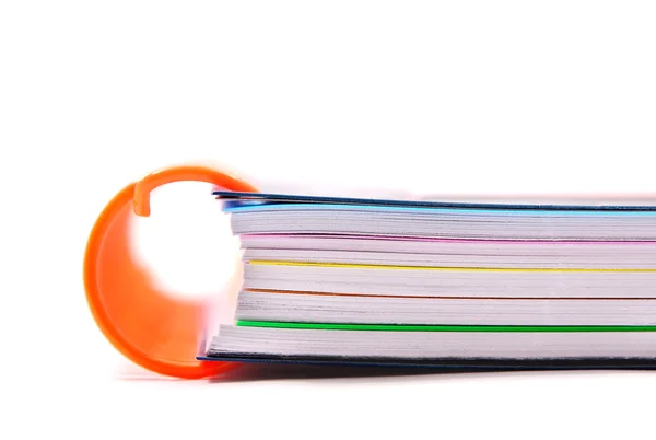 Notebooks with orange spring — Stock Photo, Image