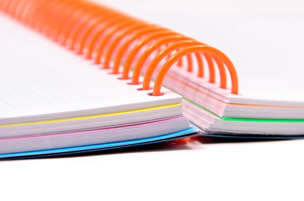 Notebooks with orange spring — Stock Photo, Image