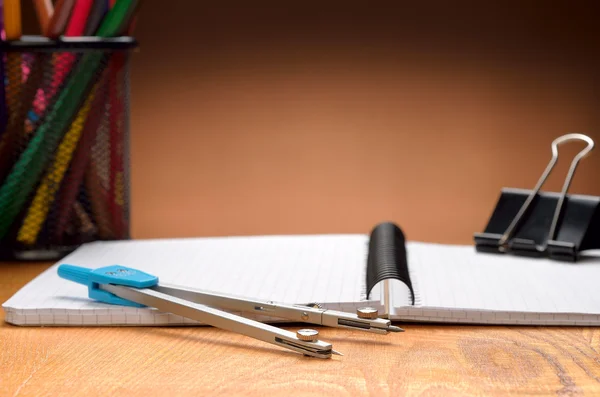 Notebook ,pencils, compass and clinch — Stock Photo, Image