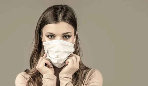 Girl Wearing Protective Mask. Woman wearing surgical mask for corona virus. Woman wearing an anti virus protection mask. Woman wearing medical face mask