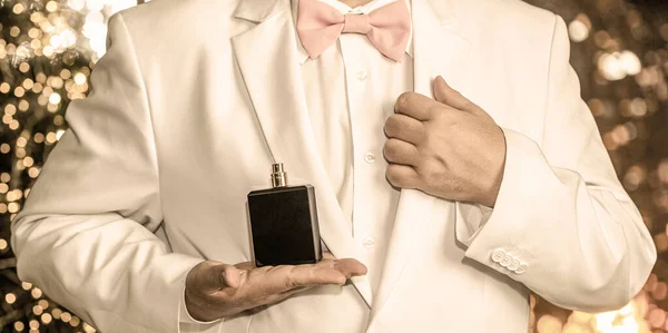 Perfume or cologne bottle. Fashion cologne bottle. Fragrance smell. Male fragrance, perfumery, cosmetics. Smell perfume. Expensive suit. Rich man prefers expensive fragrance smell. Man scent perfume — Stock Photo, Image