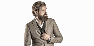 Takım elbiseli adam. Erkek sakalı ve bıyığı. Seksi erkek, vahşi maço, hippi. İş elbisesi içinde kol saatiyle teslim ol. Takım elbiseli şık yakışıklı adam. Klasik takım elbiseli yakışıklı sakallı iş adamı.