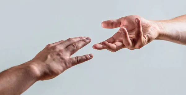 Helping hand concept, support. Friendly handshake. Two hands, shaking hands. Two hands, helping arm of a friend, teamwork. Rescue, helping gesture or hands. Close up help hand — Stock Photo, Image