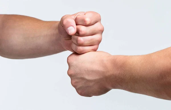 Two hands, isolated arm. Hands of man people fist bump team teamwork, success. Man giving fist bump. Team concept. People bumping their fists together, arms. Friendly handshake, friends greeting — Stock Fotó
