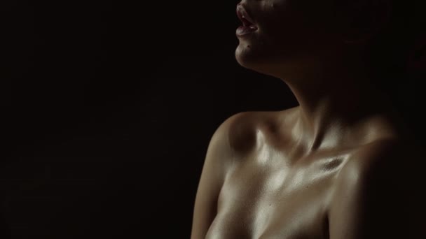 Woman during an orgasm on a black background. Sexy girl sensual lip, beauty boob. Concept of passion. Sensual woman has orgasm. Aroused girl have orgasm and screaming. Girl feels pleasure, orgasm — Vídeo de Stock