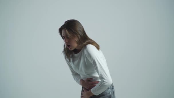 Woman Stomach Ache. Woman touching his stomach. Stomach pain and others stomach disease concept.Girl having a stomachache. Young woman suffering from abdominal pain — Stock Video