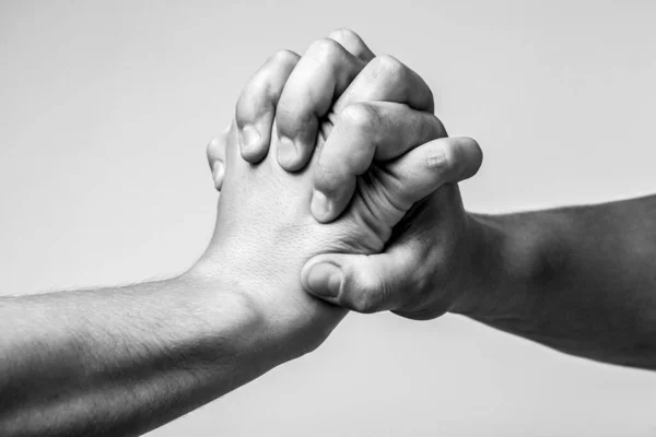 Male hand united in handshake. Man help hands, guardianship, protection. Two hands, isolated arm, helping hand of a friend. Friendly handshake, friends greeting — Stock Photo, Image