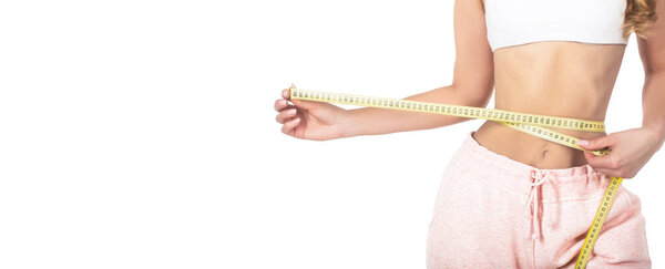 Slim girl with centimeter. Closeup woman measuring her waist with tape. Slim womans body. Woman with measuring tape. Weight loss concept. Woman take waist scale tape show her thin waist.