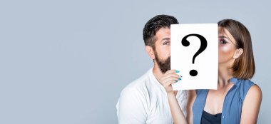Couple holding paper question mark. Anonymous, man and woman question, incognita. Problems and solutions. Couple in quarrel.