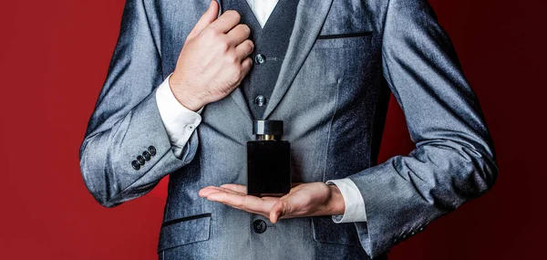 Man Holding Bottle Perfume Men Perfume Hand Suit Background Fragrance — Zdjęcie stockowe