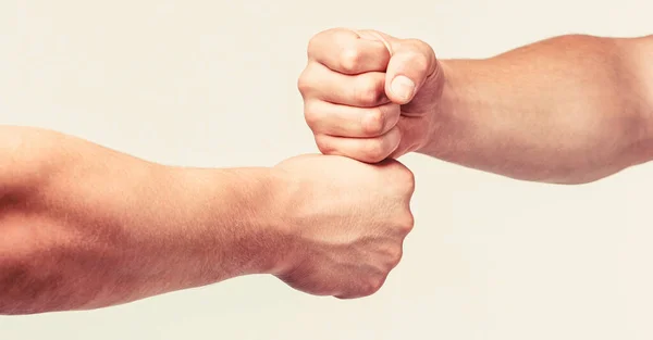 Two hands, isolated arm. Hands of man people fist bump team teamwork, success. Man giving fist bump.