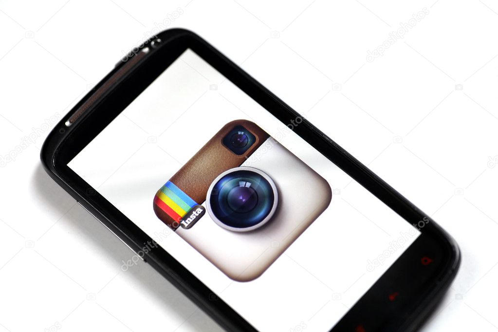 Bucharest, Romania - June 23, 2012: Close up shot of a smartphone displaying the Instagram logo on its screen, using a picture viewing software. Instagram is a free photo-sharing program and its distinctive feature is that it takes square shape photo