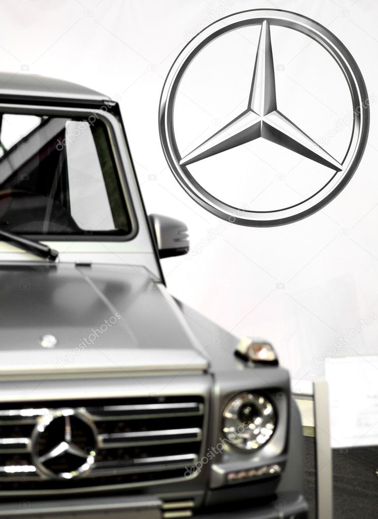 Bucharest, Romania - October 22, 2012: Mercedes logo is displayed next to a car in Bucharest. Mercedes-Benz is a multinational division of the German manufacturer Daimler AG, that produces automobiles, buses, coaches, and trucks.