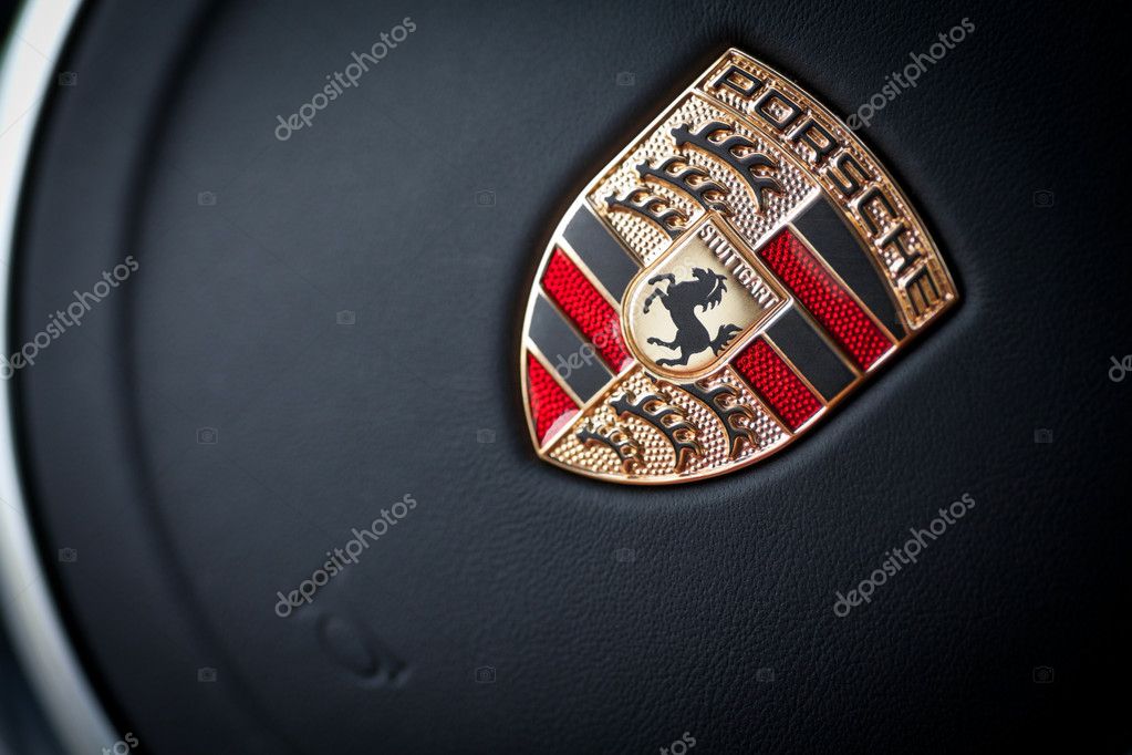 Bucharest, Romania - June 13, 2013: Detail on the logo of a Porsche car on the steering wheel. Porsche is a German automobile producer, headquartered in Zuffenhausen, Stuttgart.