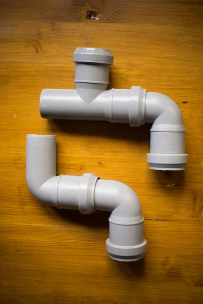 Close Shot Some Pvc Pipes Connectors Wooden Background — Stock Photo, Image