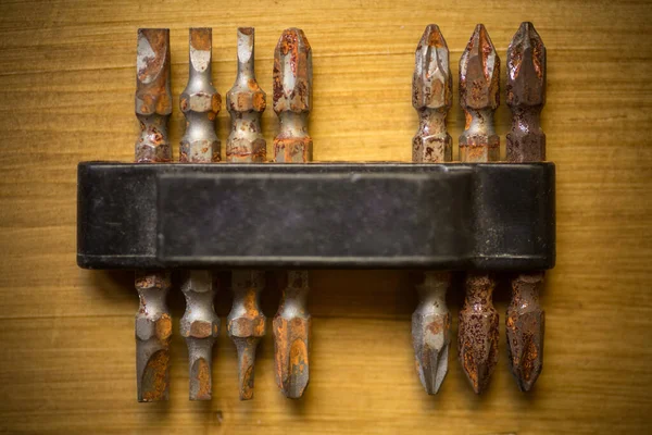 Close Shot Some Used Rusty Screwdriver Heads Bits Wooden Background — Stock Photo, Image