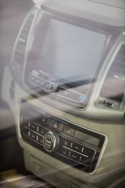 Close-up shot of a car\'s multimedia and navigation display on the dashboard.