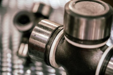 Cross of the cardan drive shaft, part of the car's transmission.