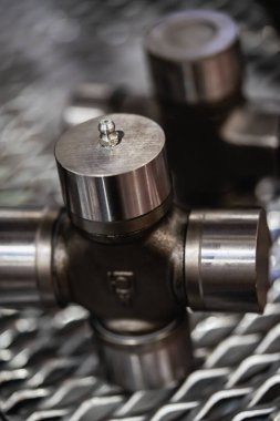 Cross of the cardan drive shaft, part of the car's transmission.